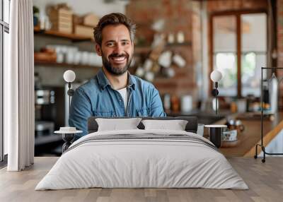 Contented man standing with coffee in his home office Wall mural