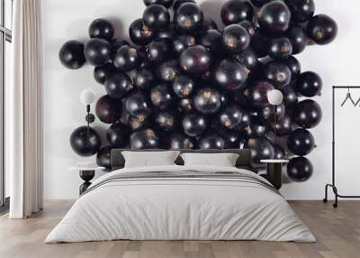 Heap of fresh black currant close up on a white Wall mural