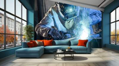 welder works with metal, mechanical engineering concept Wall mural