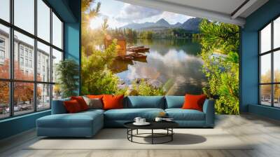 Boat on the dock surrounded mountains. Fantastic Shtrbske Pleso  Wall mural