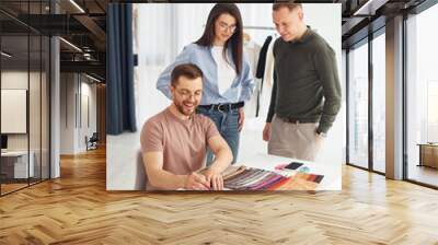 Cheerful workers. Group of people togethe in the office Wall mural