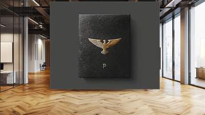 Elegant gold eagle logo on black leather background Wall mural