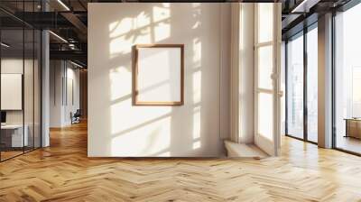 Elegant wooden frame mockup hanging on a sunny wall Wall mural