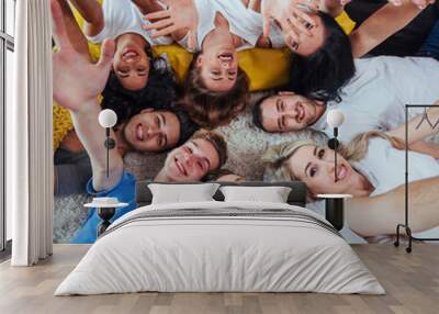 Group beautiful young people doing selfie lying on the floor, best friends girls and boys together having fun, posing emotional lifestyle concept Wall mural