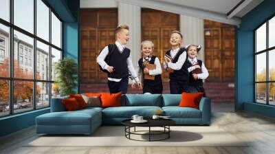 Group of kids in school uniform that is running outdoors together Wall mural