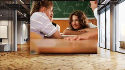 Having fun on a break time. Pupils, kids in the classroom together Wall mural