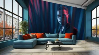 Interesting beams. Futuristic neon lighting. Young african american man in the studio Wall mural