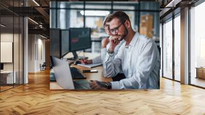 Two stockbrokers in formal clothes works in the office with financial market Wall mural