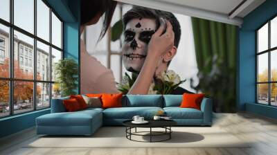 A young man is preparing makeup for Halloween. Create a Halloween look Wall mural