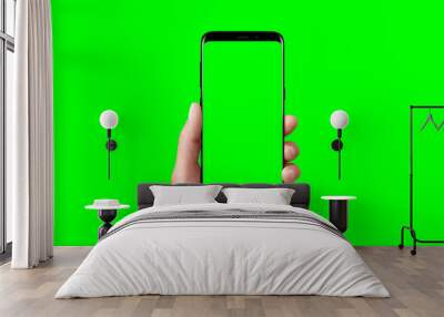 Modern phone in hand isolated. Chroma key for video mockup presentation. Wall mural