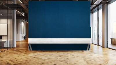 modern white table with legs and free space. blue wall texture in background. Wall mural