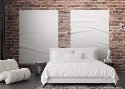 Two blank, white A3 posters are glued to the brick wall. Ideal surfaces for mockup graphic design promotion Wall mural