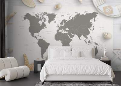 World map surrounded by shells, starfish, lifebelt, anchor. White wooden table in background. Flat lay, top view. Wall mural