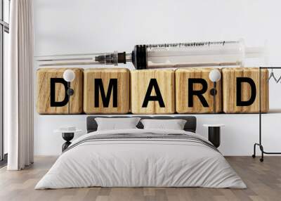 Text DMARD made from wooden cubes. White background Wall mural