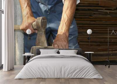 The worker, a man with an ax chopping firewood . Employee. Wall mural