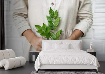 hands holding plant, eco clothes Wall mural