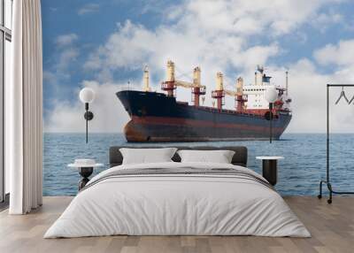 Dry cargo ship floating on the sea Wall mural