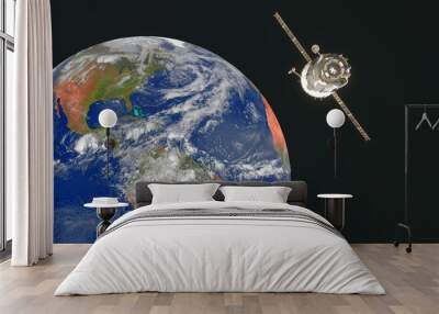 Satellite orbiting the earth in space.. Elements of this image furnished by NASA Wall mural