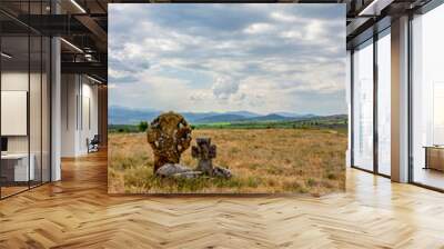 Two ancient stone crosses on a hill in the Bulgarian village of Chukovezer, Dragoman Municipality, Sofia Province under dramatic sky Wall mural