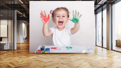 the child leaves his handprints on paper Wall mural