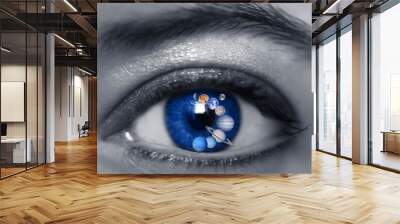 beautiful blue eye with planets like astrology and planet concept, universe and space, galaxy and astronomy Wall mural