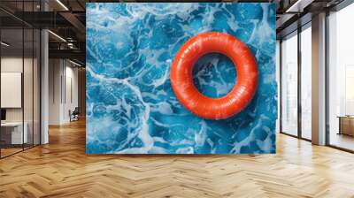 red swimming pool ring floating on the calm water in the swimming pool. High angle view with copy space. High quality photo Wall mural