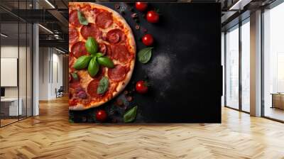 Tasty pepperoni pizza and cooking ingredients tomatoes basil on black concrete background. Top view of hot pepperoni pizza. With copy space for text. Flat lay. Banner. High quality photo Wall mural