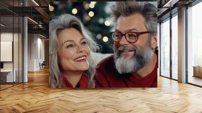 A man and woman smiling at each other in front of a christmas tree, AI Wall mural