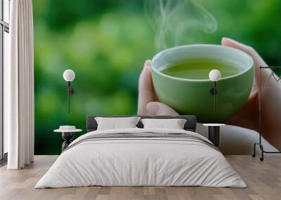 A person holding a cup of green tea with steam coming out, AI Wall mural