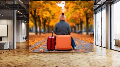 A person sitting on a bench with two suitcases and an orange tree, AI Wall mural