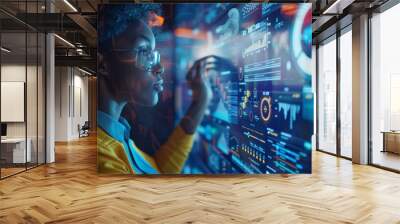 A woman in glasses looking at a large screen with data on it, AI Wall mural