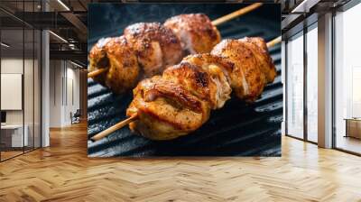 Two pieces of chicken on skewers are cooking in a grill, AI Wall mural