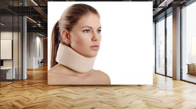 Close up of young female wearing neck collar on white background. Concept of osteoporosis or neck injury.   Wall mural