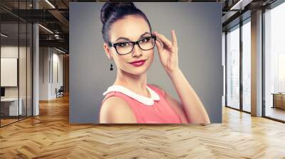 fashionable woman with professional hairdo in eyeglasses Wall mural