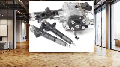 Two new solenoid injectors for diesel fuel lying on a white background with a rod and a fuel injection pump Wall mural