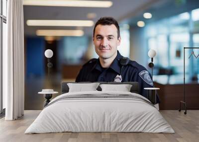 Caucasian male cop demonstrating dedicated smiling officer. Official uniform serves as symbol of honor and source of inspiration reminding people of commitment to serve with protect Wall mural