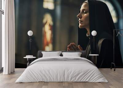 Close-up photo of a young Caucasian nun praying in catholic church. Wall mural