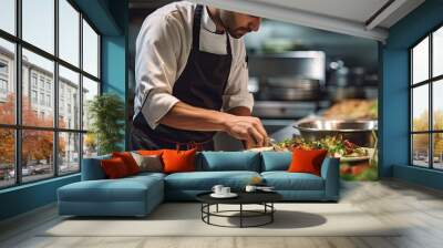 Cropped photo of a chef preparing a salad in a restaurant for visitors. Cook man neatly decorates the dish. Young professional chef adding some piquancy to meal. Format photo 5:2. Wall mural