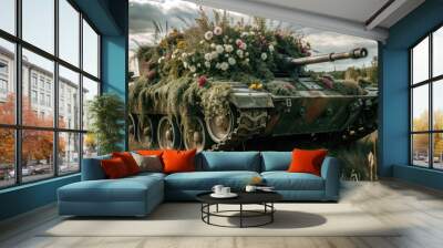 A modern tank covered with grass and flowers stands in a field, tank, military, grass, flowers, camouflage, nature, war, machine Wall mural