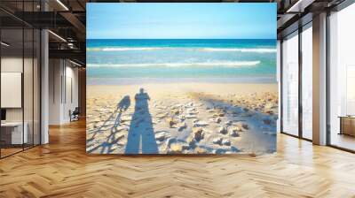 Person, view and ocean with shadow on sand for vacation and environment to relax in Brazil. Adventure, explore and landscape of island, sea and beach in Rio de Janeiro destination for outdoor travel Wall mural