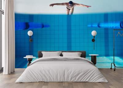 Diver, water and person in pool, swimming and cardio for competition, blue and race. Mockup, clean and aquatic sports for exercise, recreational and liquid for athlete, space and arena for fitness Wall mural