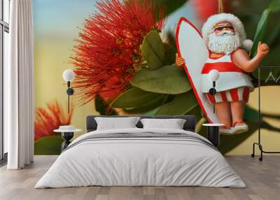 Close-up of flowers of New Zealand's native Pohutukawa tree with Santa Christmas decoration. The tree flowers over the NZ summer and is often referred to as the New Zealand Christmas tree. Wall mural