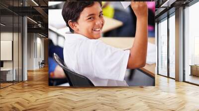 Portrait, student and paper plane in classroom and happy, learning at desks or Indian boy, play and origami jet or class distraction. Playful smile, kid and holding airplane and middle school fun Wall mural