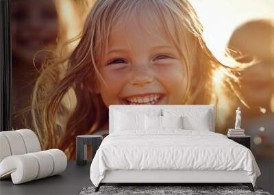 little girl laughing happily at sunset Wall mural