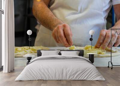 pizza chef at work creates a margherita pizza in an Italian pizzeria Wall mural