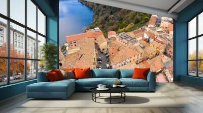 Aerial view of Genzano di Roma, a small town located in the Metropolitan City of Rome, Italy. The town is part of the Castelli Romani area. In background it is Nemi lake, a small volcanic lake. Wall mural