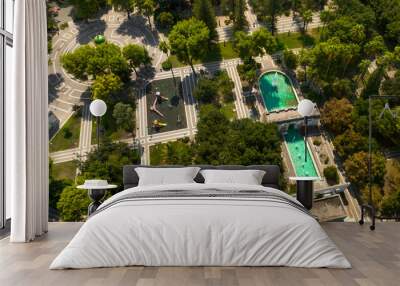 Aerial view of the fountain and gazebo in Giuseppe Garibaldi public gardens in Lecce, Puglia, Italy. It is a green area with trees and flowerbeds in the historic center of the apulian city. Wall mural