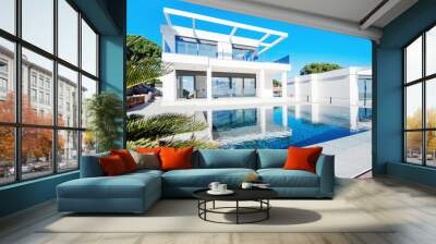 The modern facade of a luxury villa with a large swimming pool. Luxury MODERN property. Wall mural