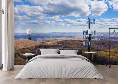 Aerial view of mobiel phone cell tower over forested rural area of West Virginia to illustrate lack of broadband internet service Wall mural