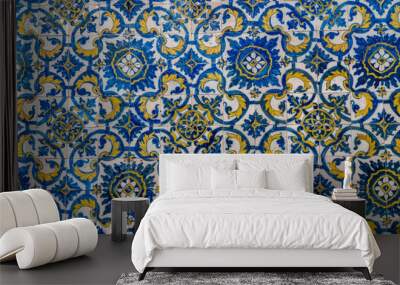 Pattern of blue and yellow old azulejo tiling on wall in traditional Portuguese style Wall mural